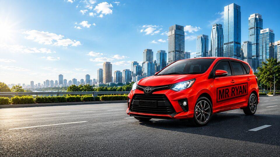 Toyota Calya merah dengan tulisan MR RYAN di jalan kota berlatar gedung tinggi dan langit biru cerah.